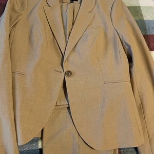 Tan suit jacket, pants and skirt